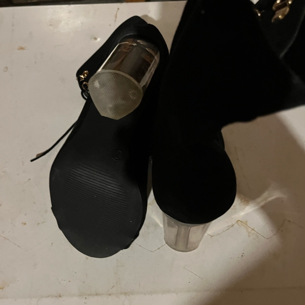 Black lace up boot. Clear heel